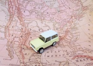 car on u.s. map for a road trip